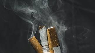 strong-hand-crushing-cigarettes-highlighting-antismoking-themes-health-awareness-dark-background